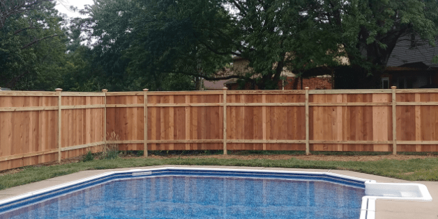 Tall wooden privacy fence